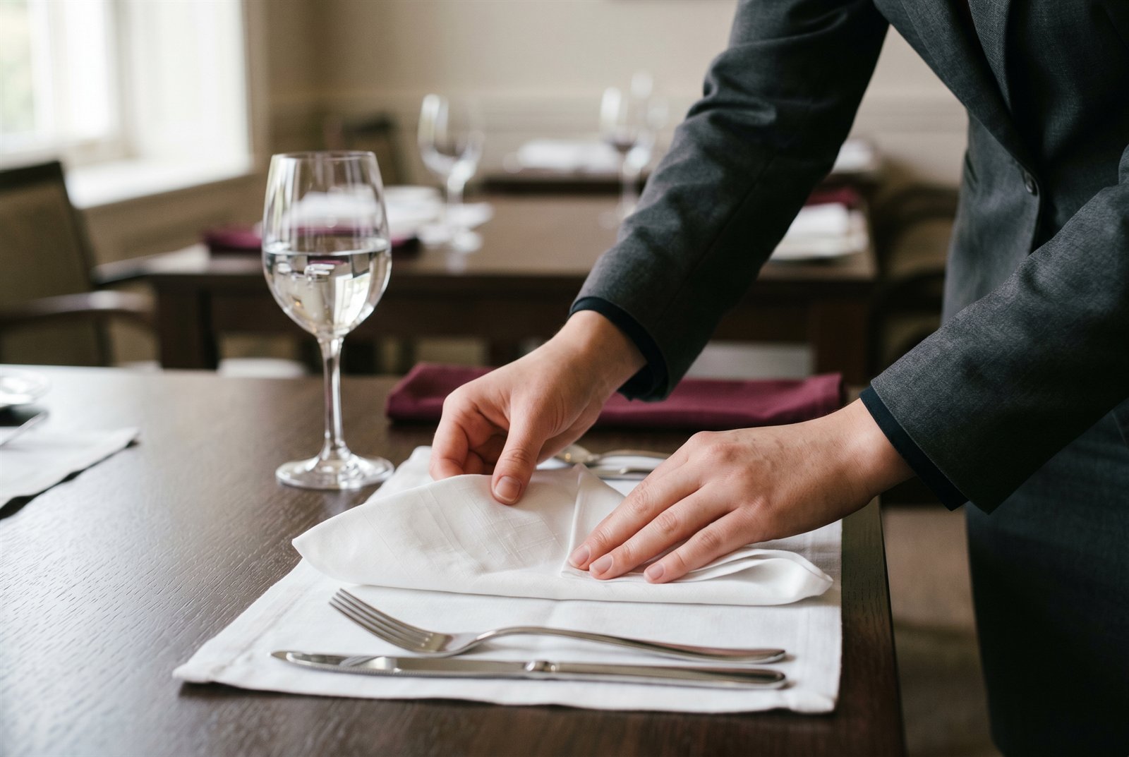 Napkin-folding practice at the MJIC Hospitality School